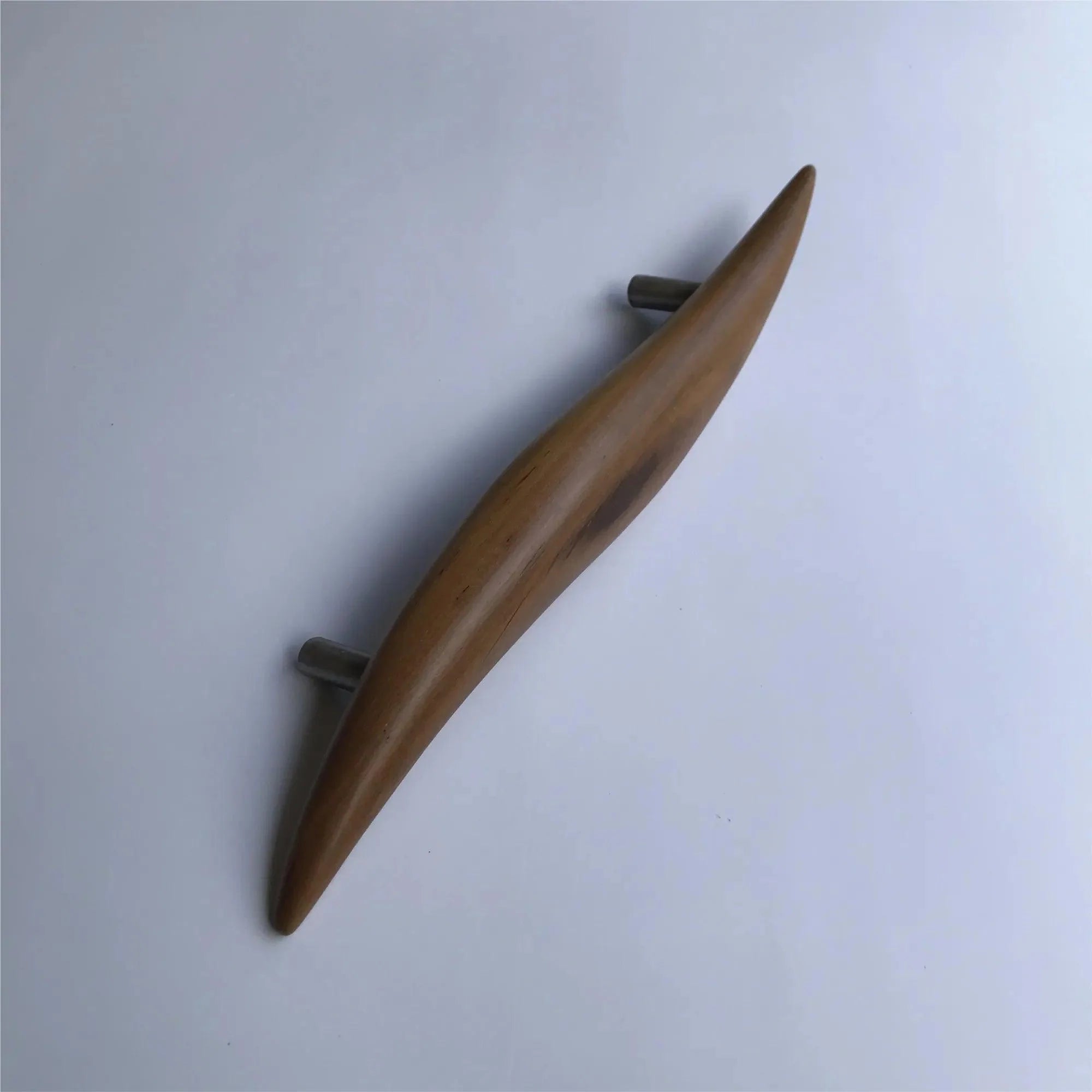Elegant teak door handle by Wood Ceylon featuring a smooth, curved design for modern interiors