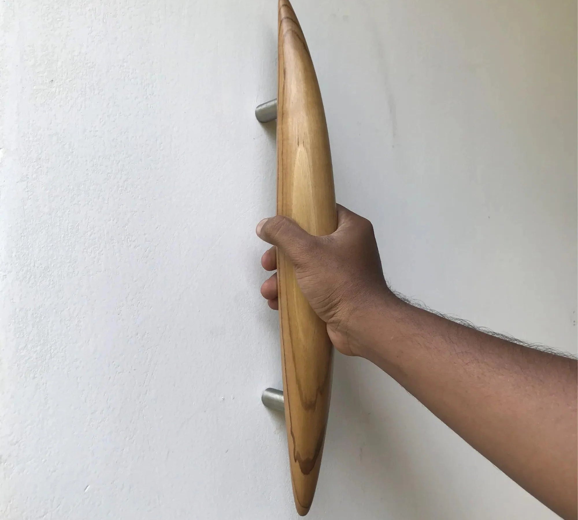 Sleek wooden front door handle crafted from natural wood for modern entryways