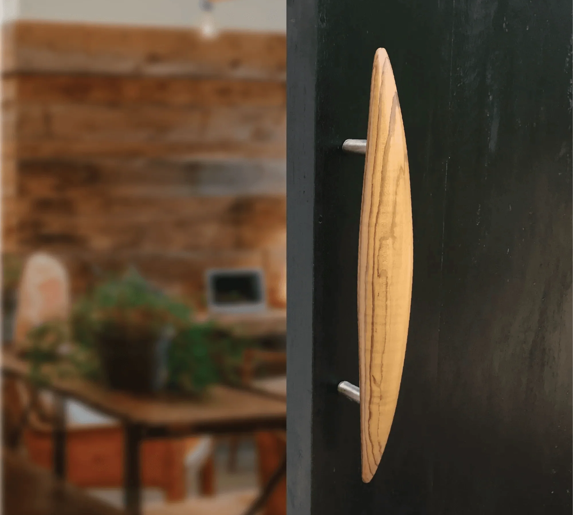 Elegant wooden front door handle with a sleek design suitable for modern entrances