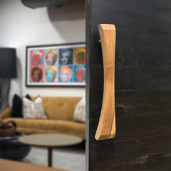 Wood Ceylon natural wooden sliding door handle mounted on dark sliding door in modern living room