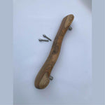 Wood Ceylon wooden door handle with natural grain and included mounting screws on white background