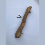 Wood Ceylon wooden door handle with natural grain and included mounting screws on white background