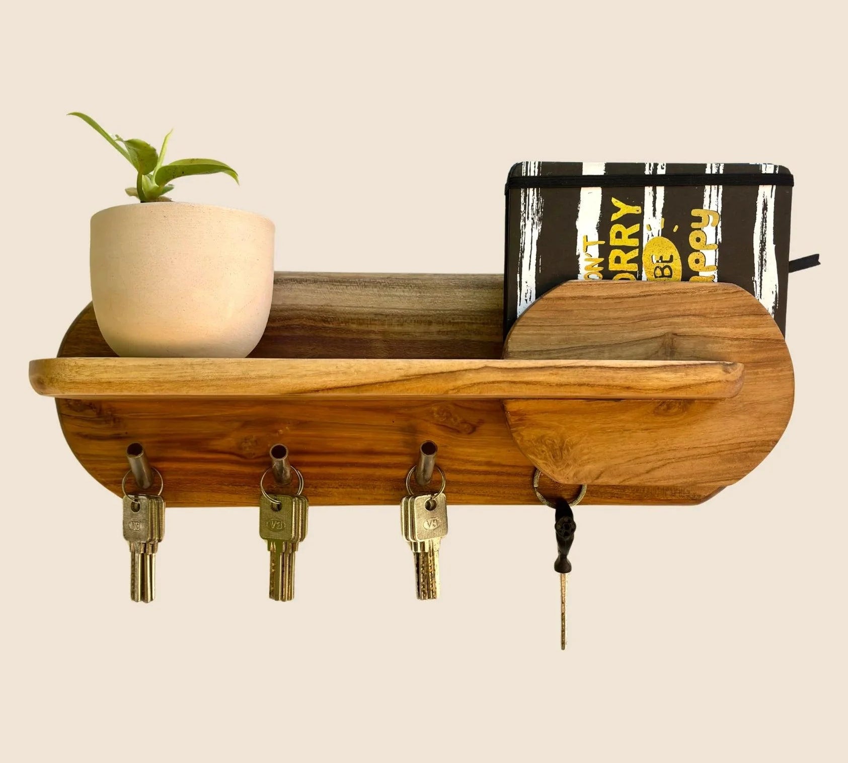 Wooden key holder with shelf featuring hooks and a plant pot for stylish organization