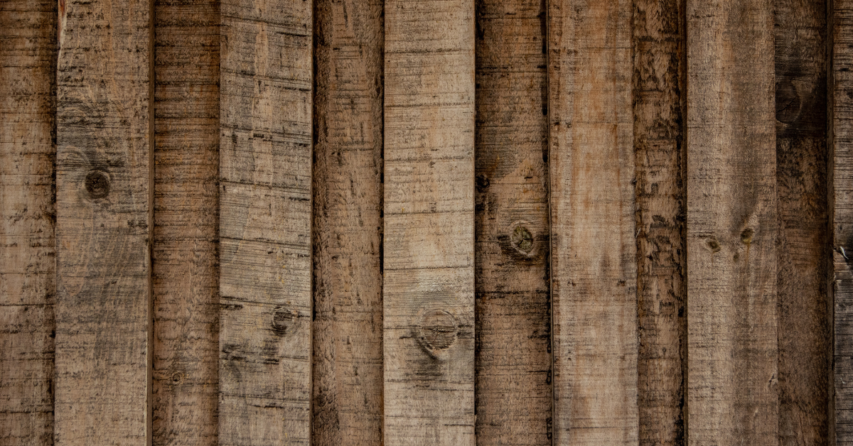 Close-up texture of reclaimed wood planks showcasing natural grain and rustic appearance