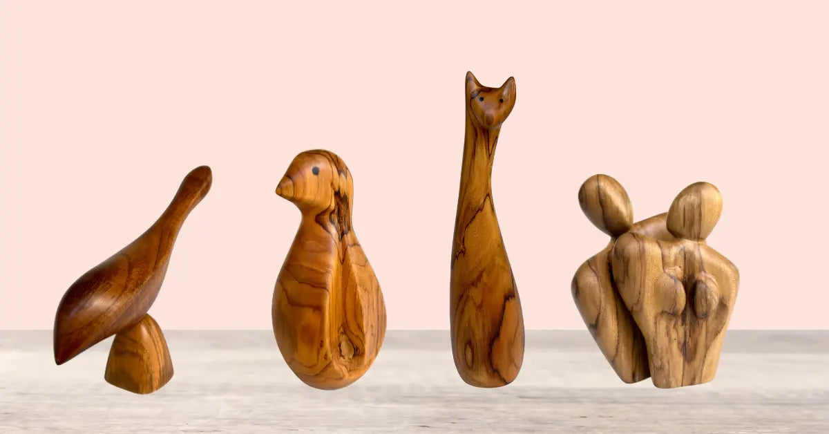 Handcrafted wood sculpture collection featuring abstract animal figures made of polished teak wood