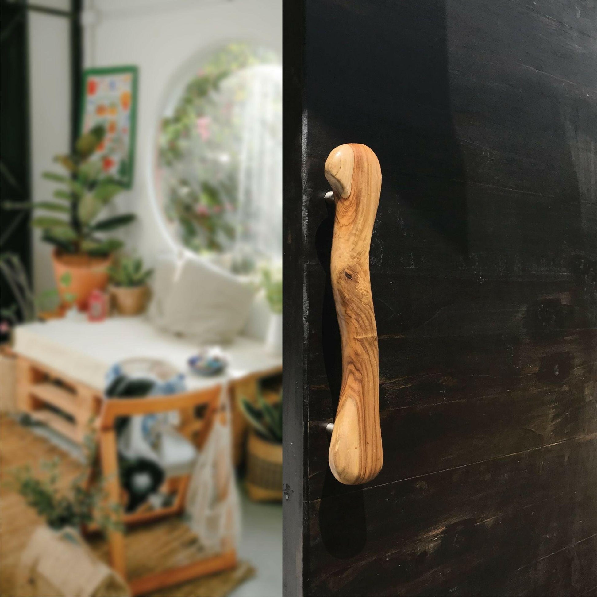 Wood Ceylon wooden door handle with smooth natural finish on black door in cozy living space