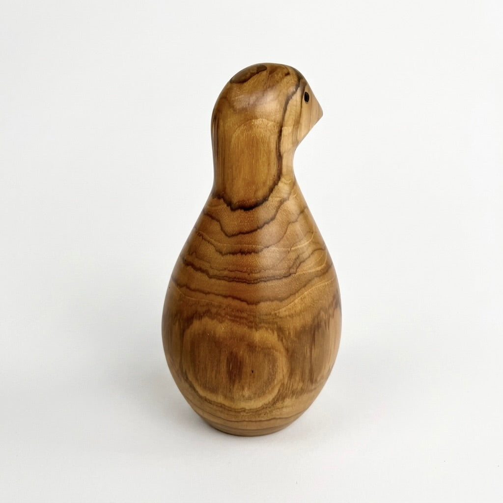 Teak bird sculpture, left profile showing carved detail