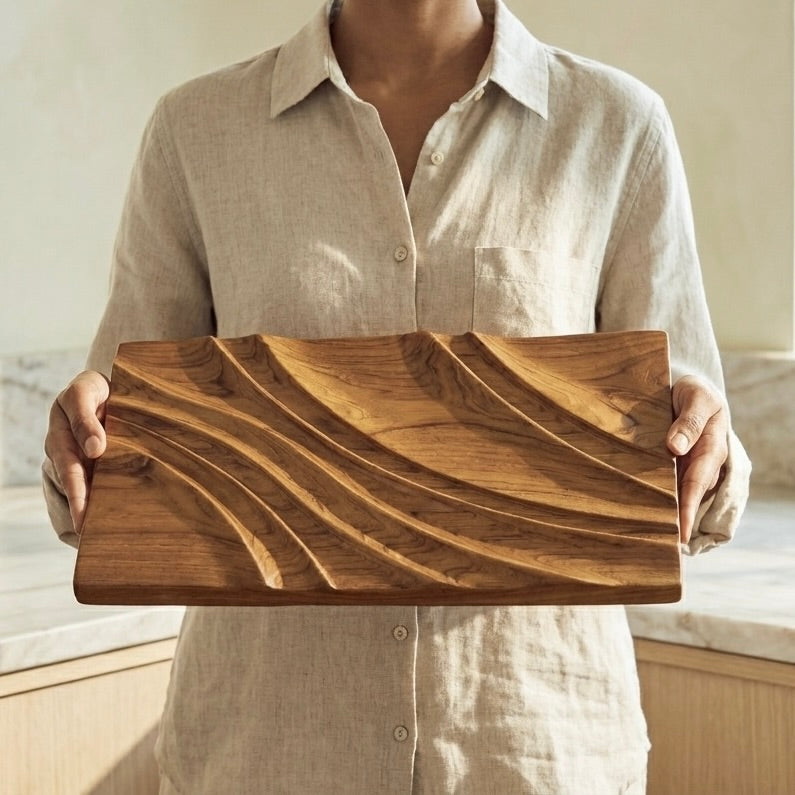 Handmade teak wood wall art hung in a modern living room interior