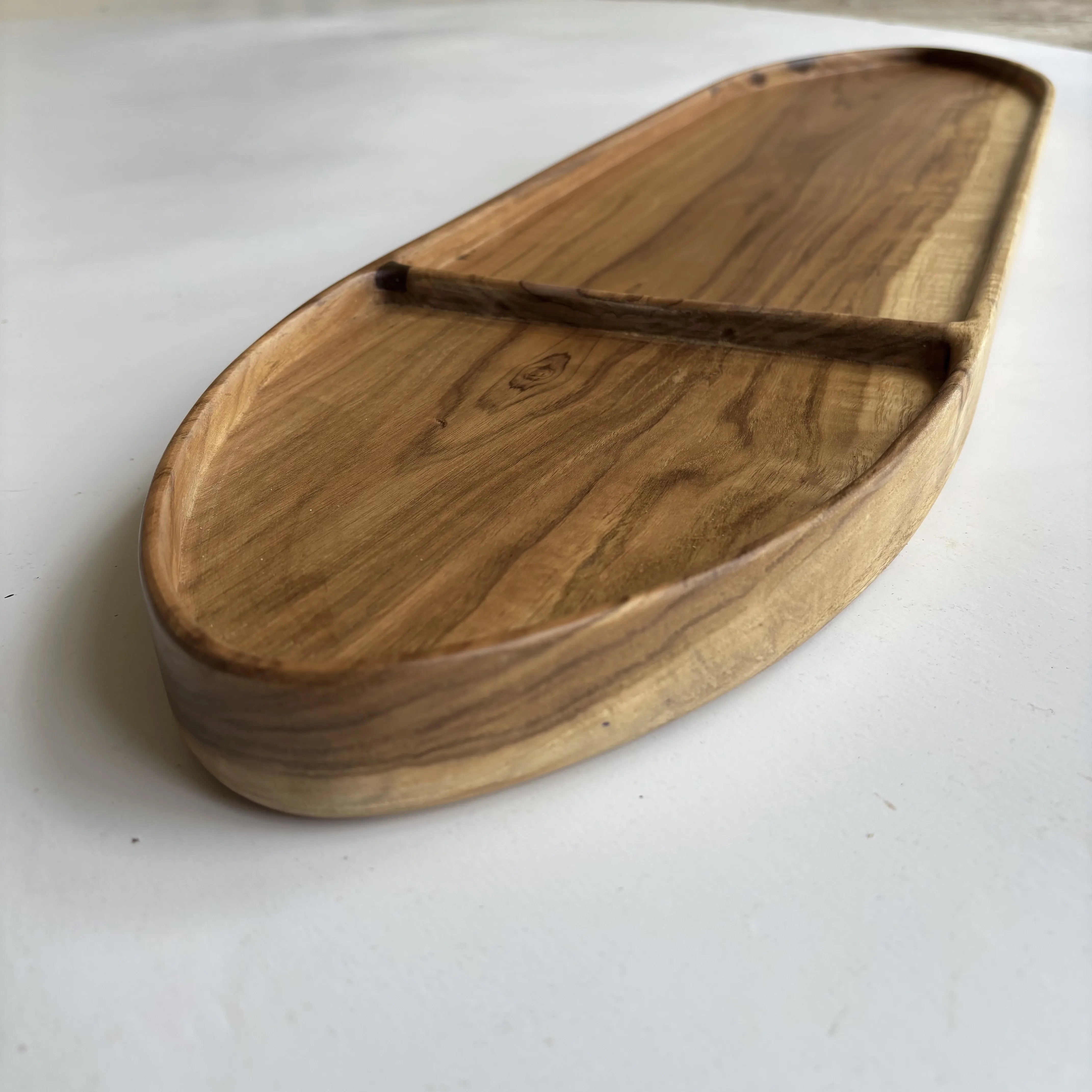 Solid teak bathtub caddy resting across white freestanding tub — WoodCeylon Sri Lanka