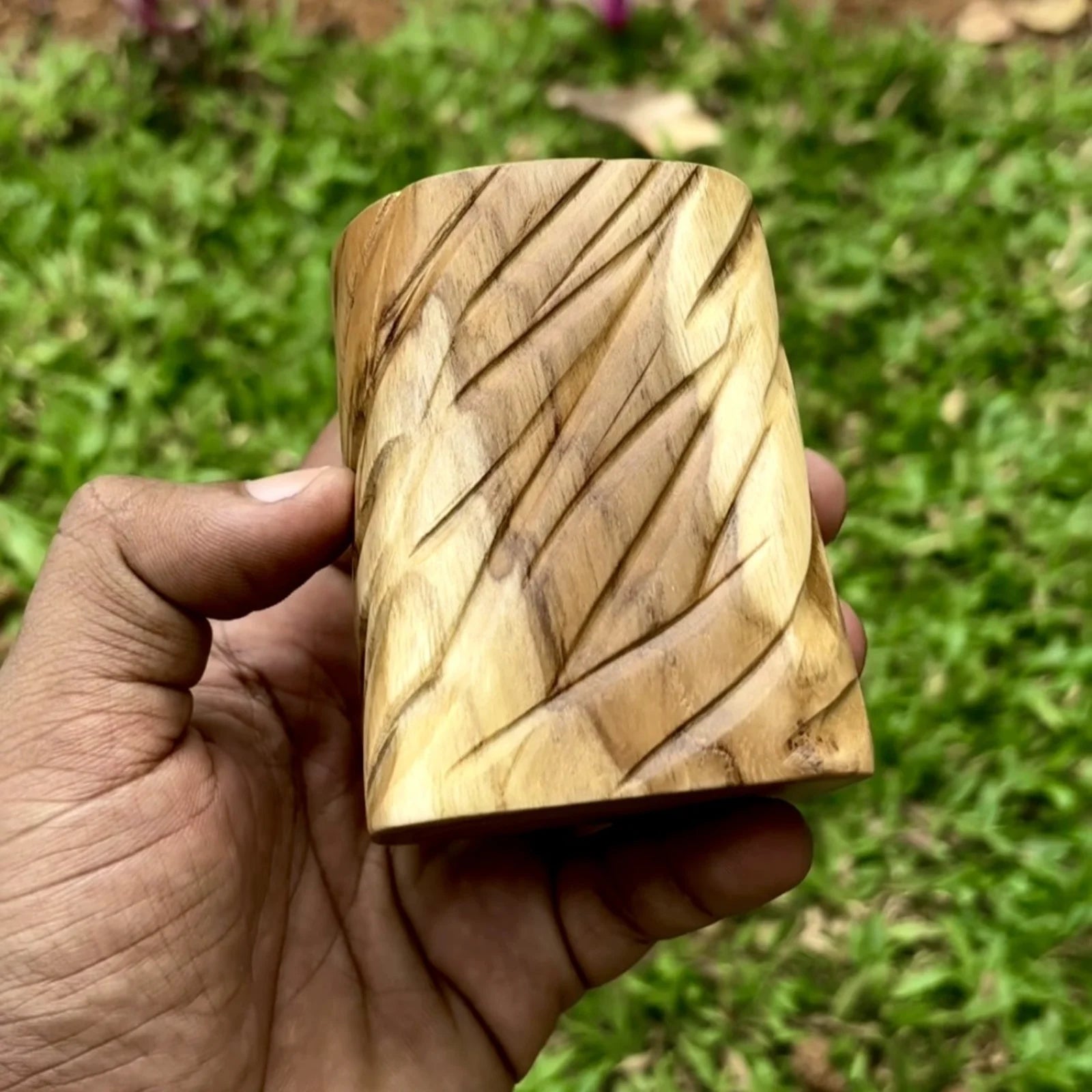 Teak wood succulent planter with unique carved design for stylish decor