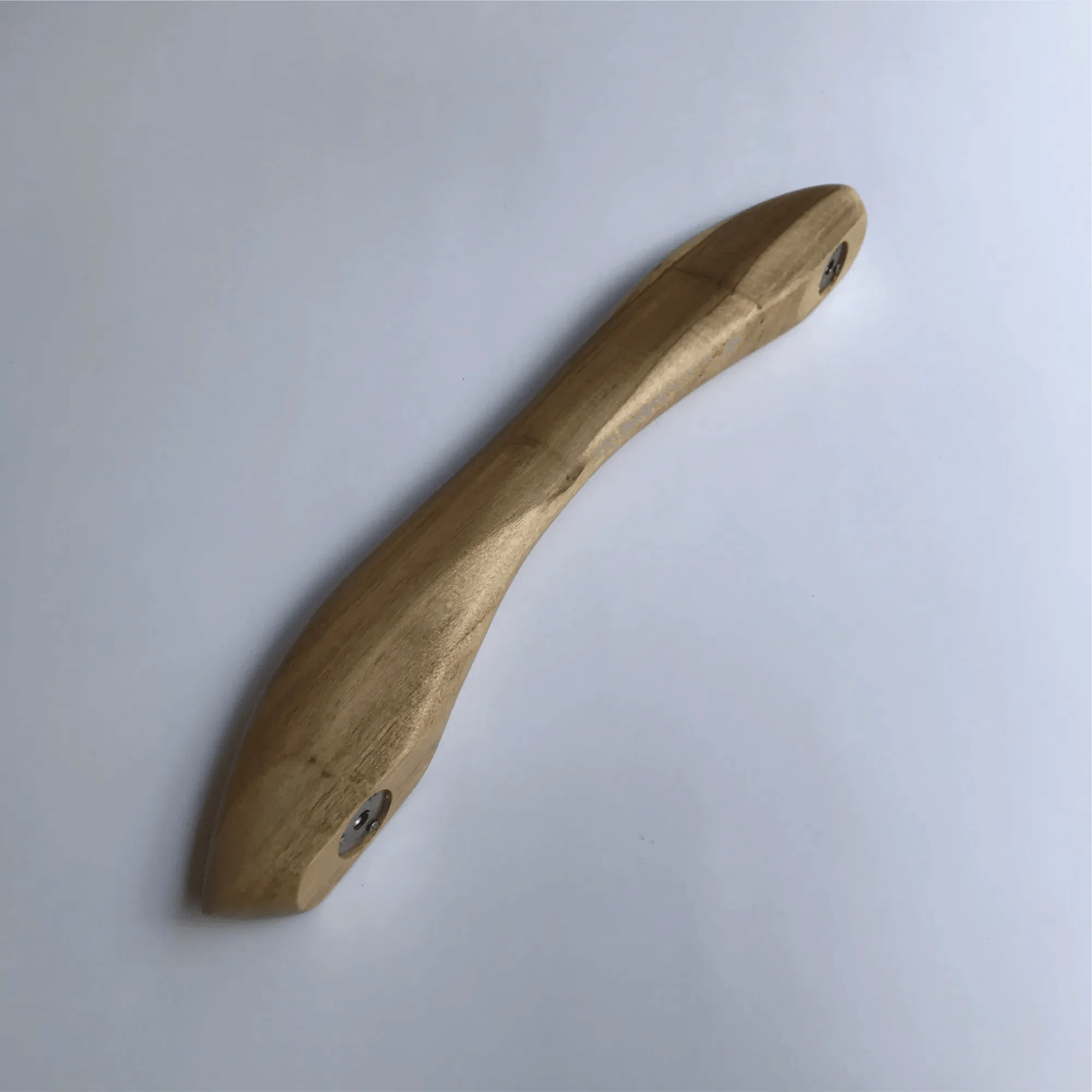 Natural wood closet door handle with a smooth ergonomic design for easy grip and stylish decor