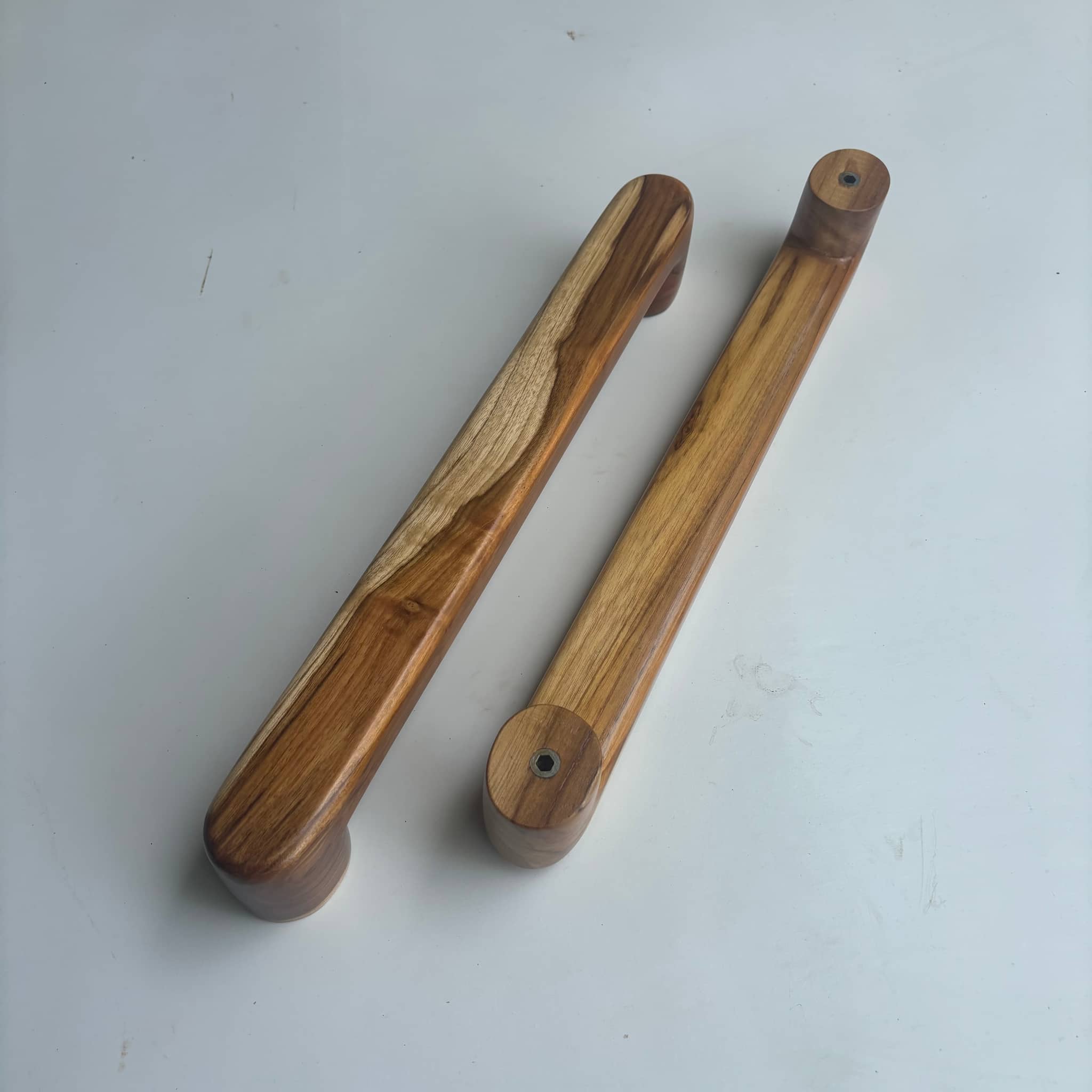 Teak door handles in natural wood finish for stylish entryways
