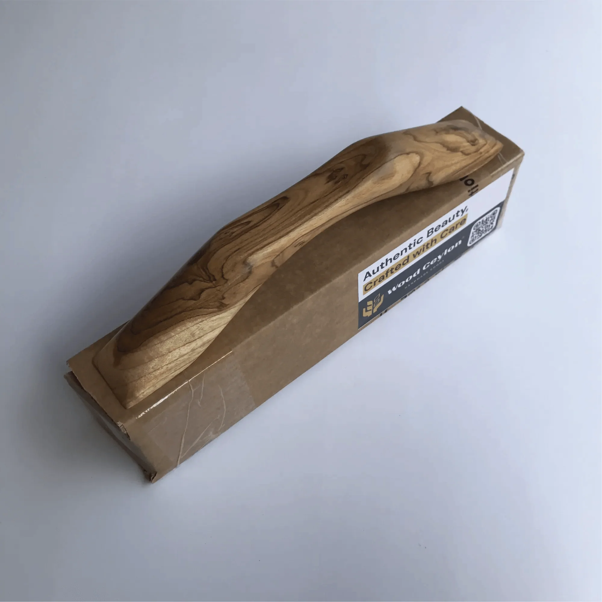 Natural wood drawer pull from Wood Ceylon with a sleek design and authentic beauty