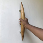 Sleek wooden front door handle crafted from natural wood for modern entryways
