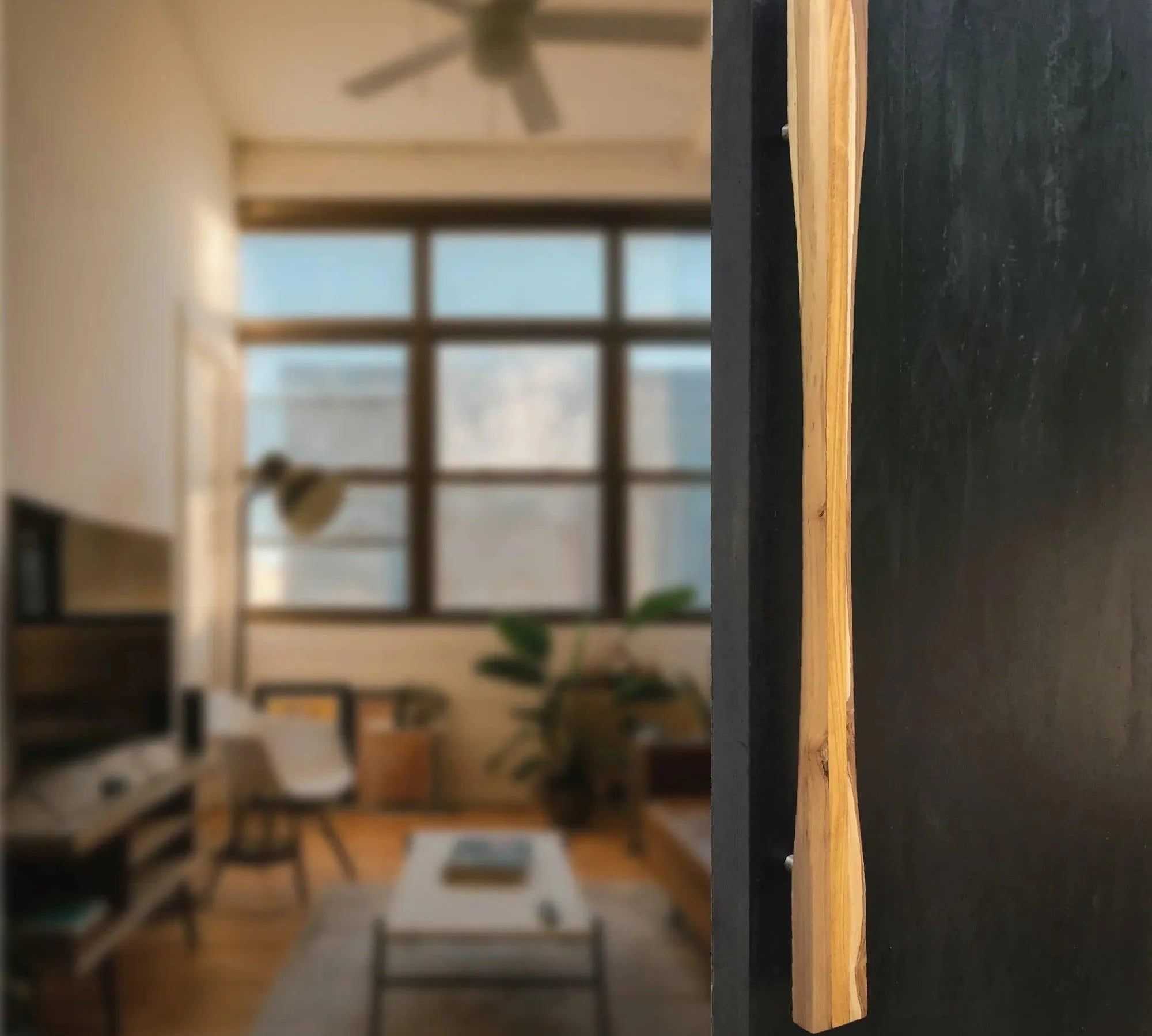 Elegant large front door handle in natural wood finish perfect for modern home entrances