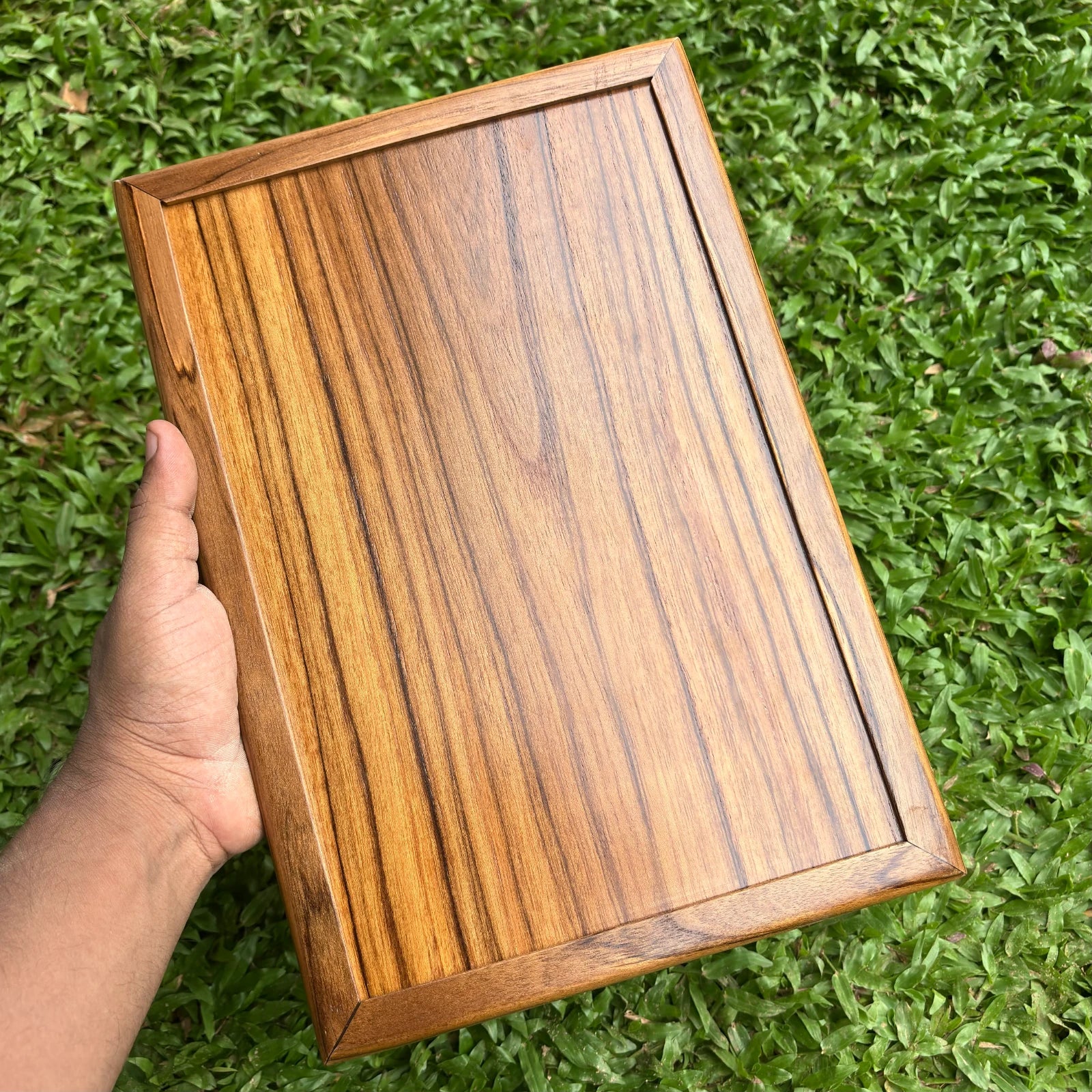 Wood Ceylon wooden board for laser engraved menu card with natural wood grain held by hand