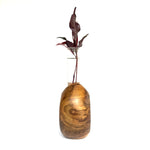 Modern teak flower holder with elegant shape and clear glass insert for vibrant floral displays