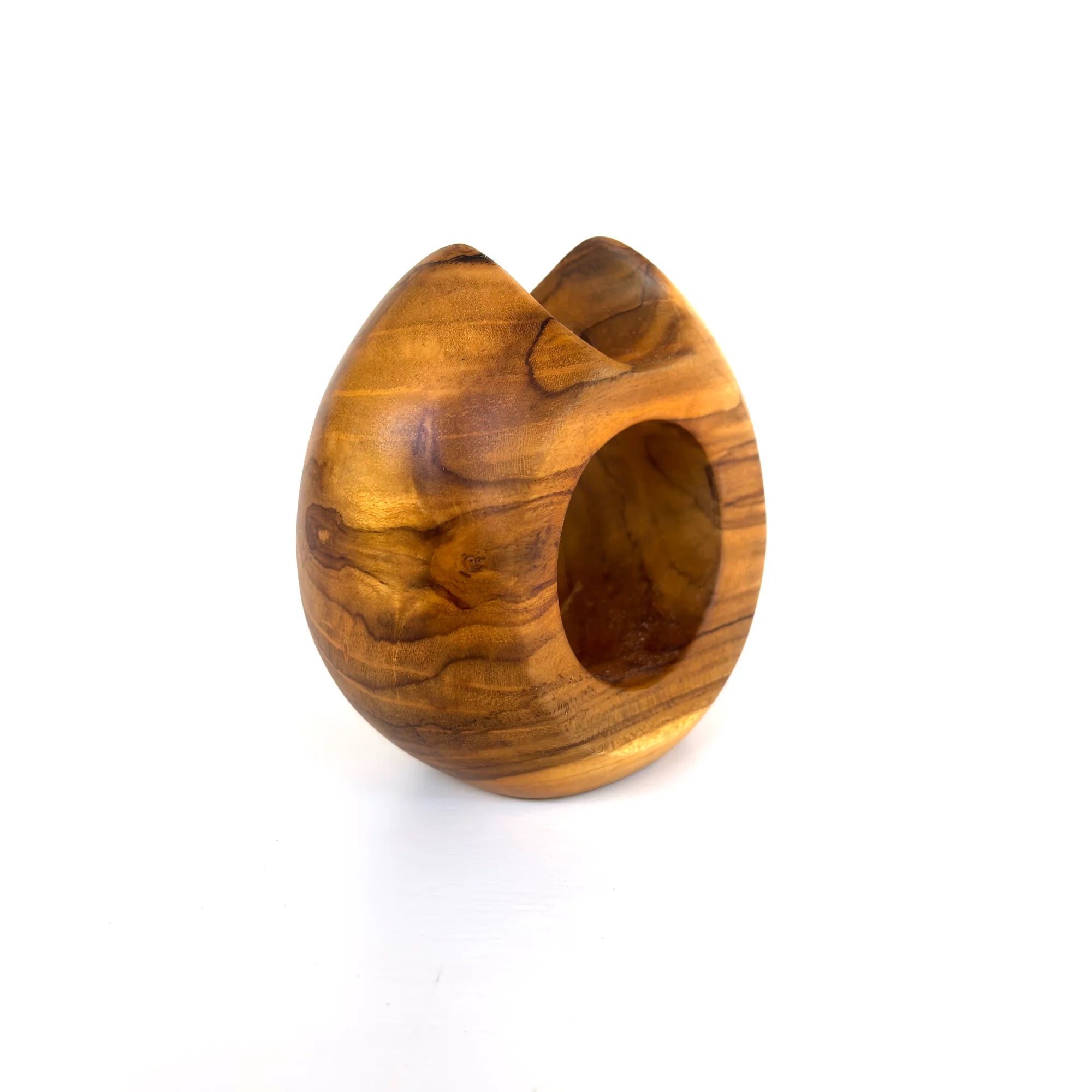 Modern teak flower holder with a unique egg-shaped design for stylish floral arrangements