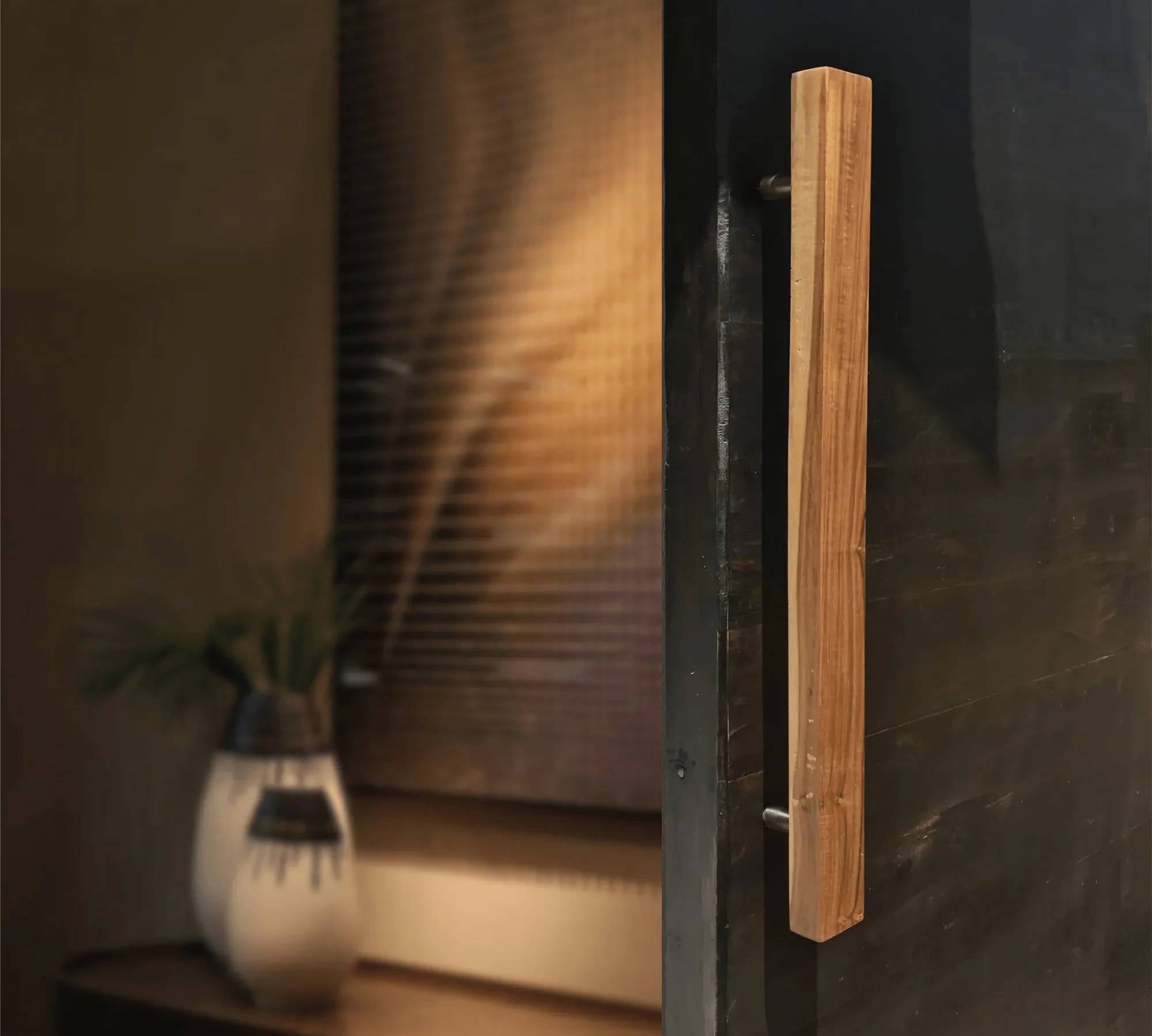 Solid teak door handle elegantly designed for modern doors with a sleek finish