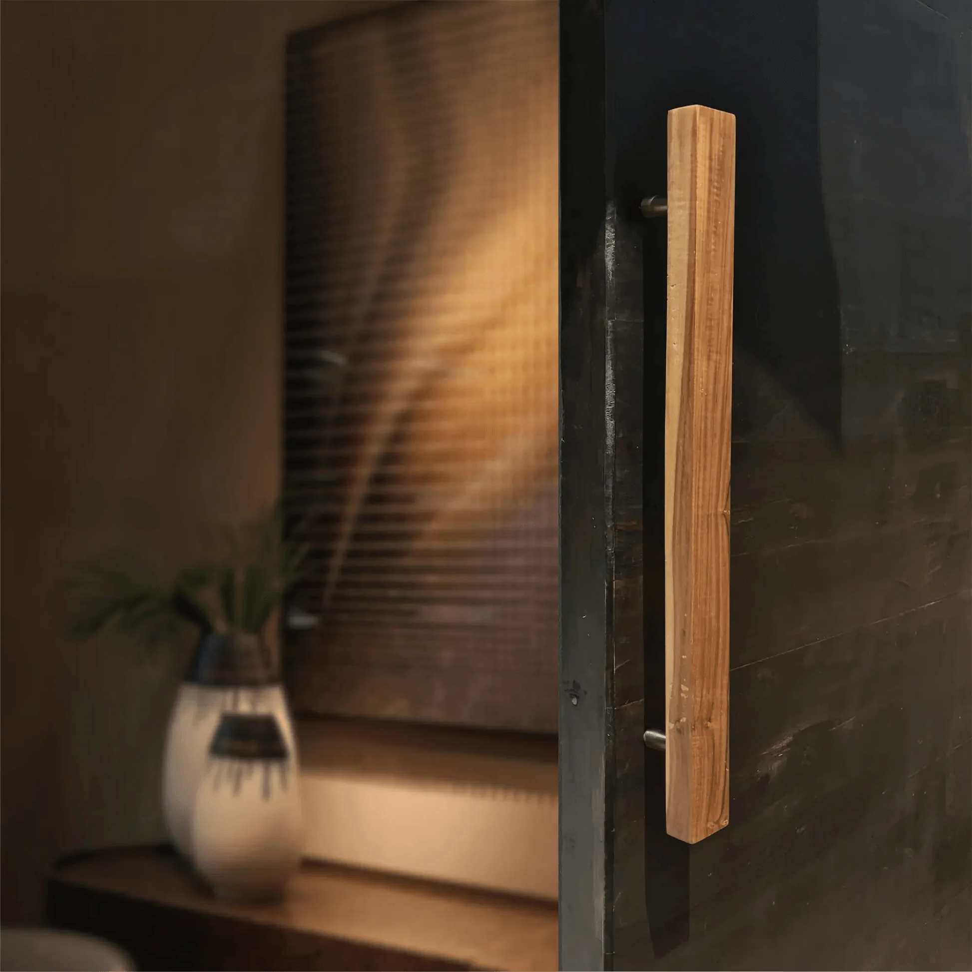 Solid teak door handle elegantly designed for modern doors with a sleek finish