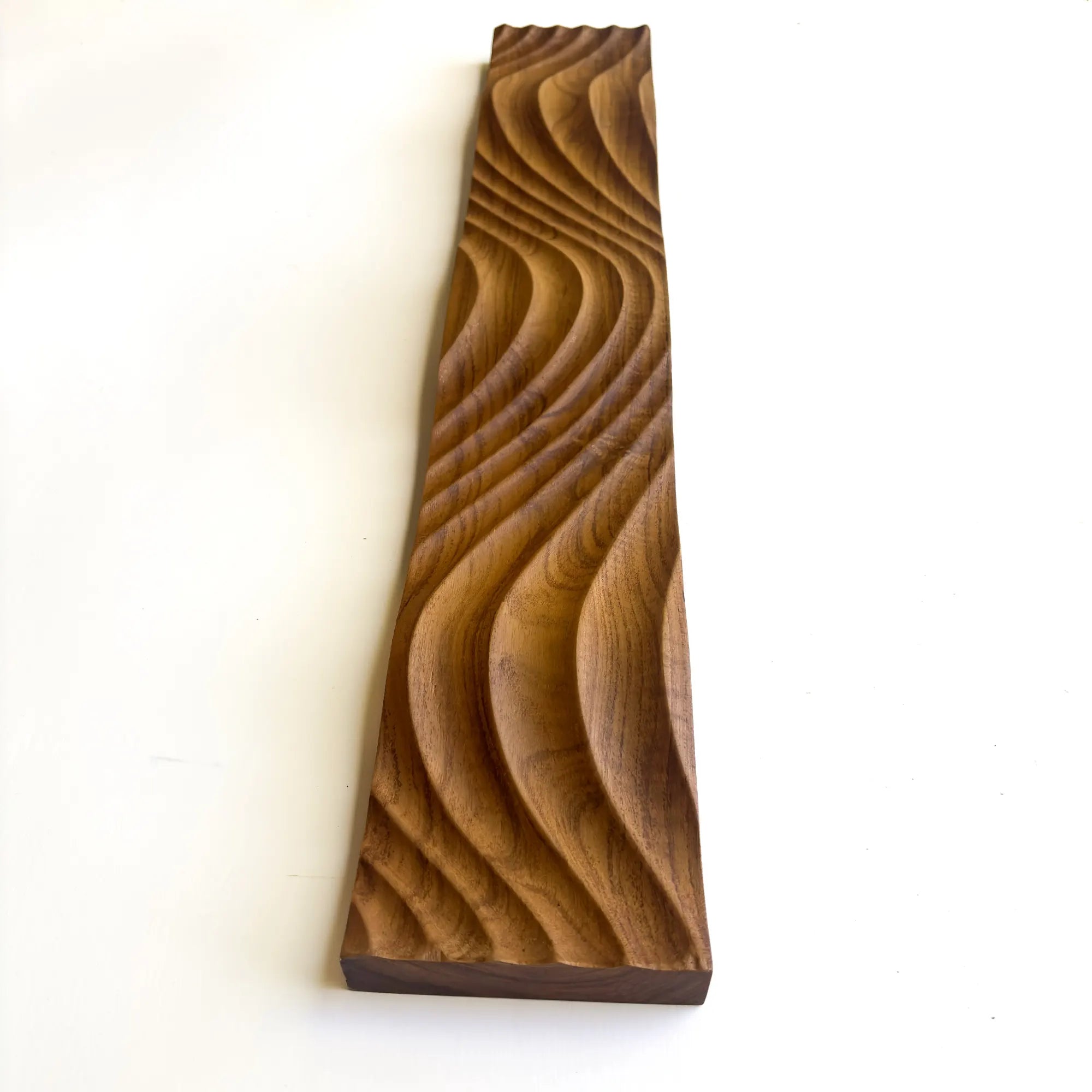 Carved solid teak wood panel with wavy texture for home decor and artistic displays