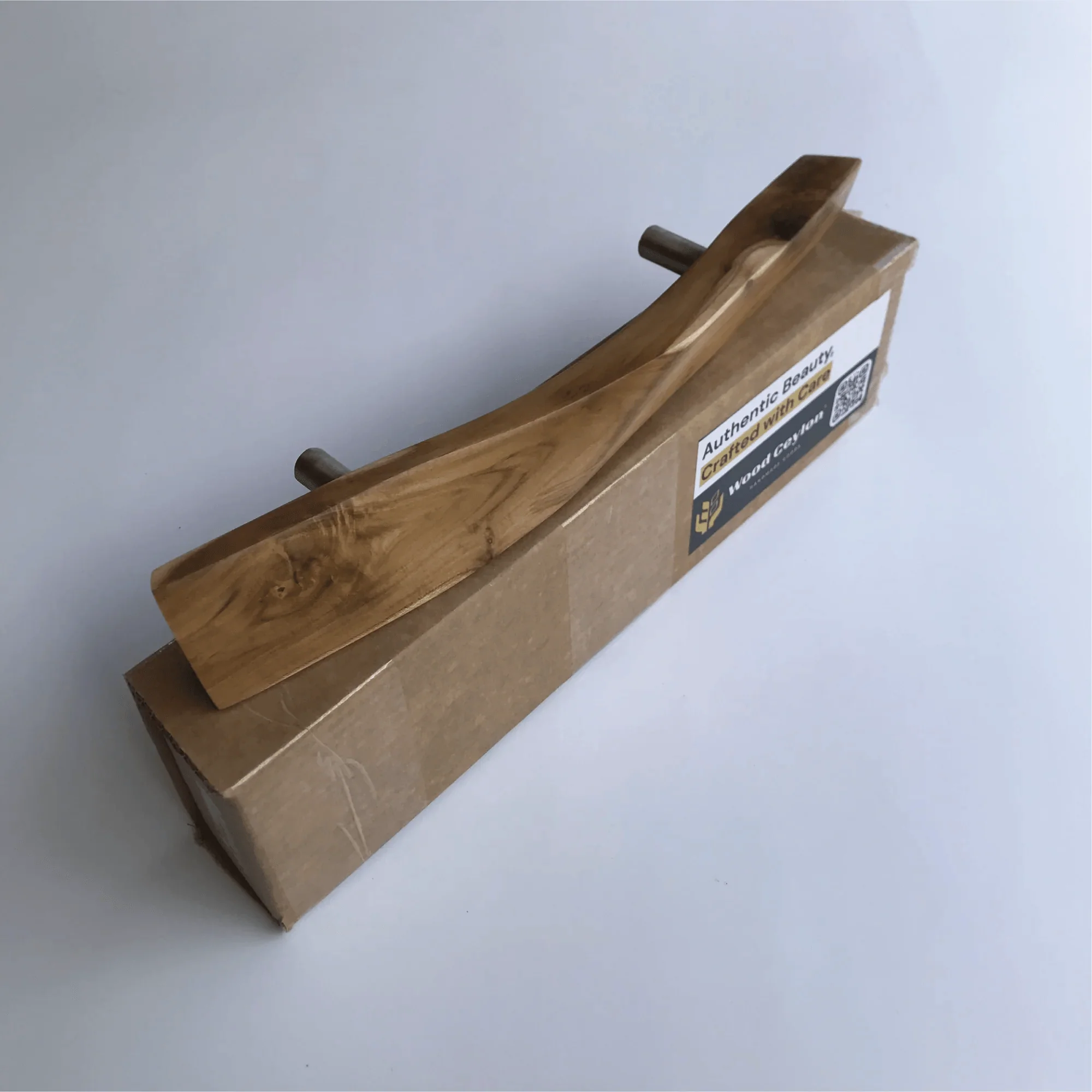 Stylish solid wooden door handle by Wood Ceylon with a natural finish and smooth curves