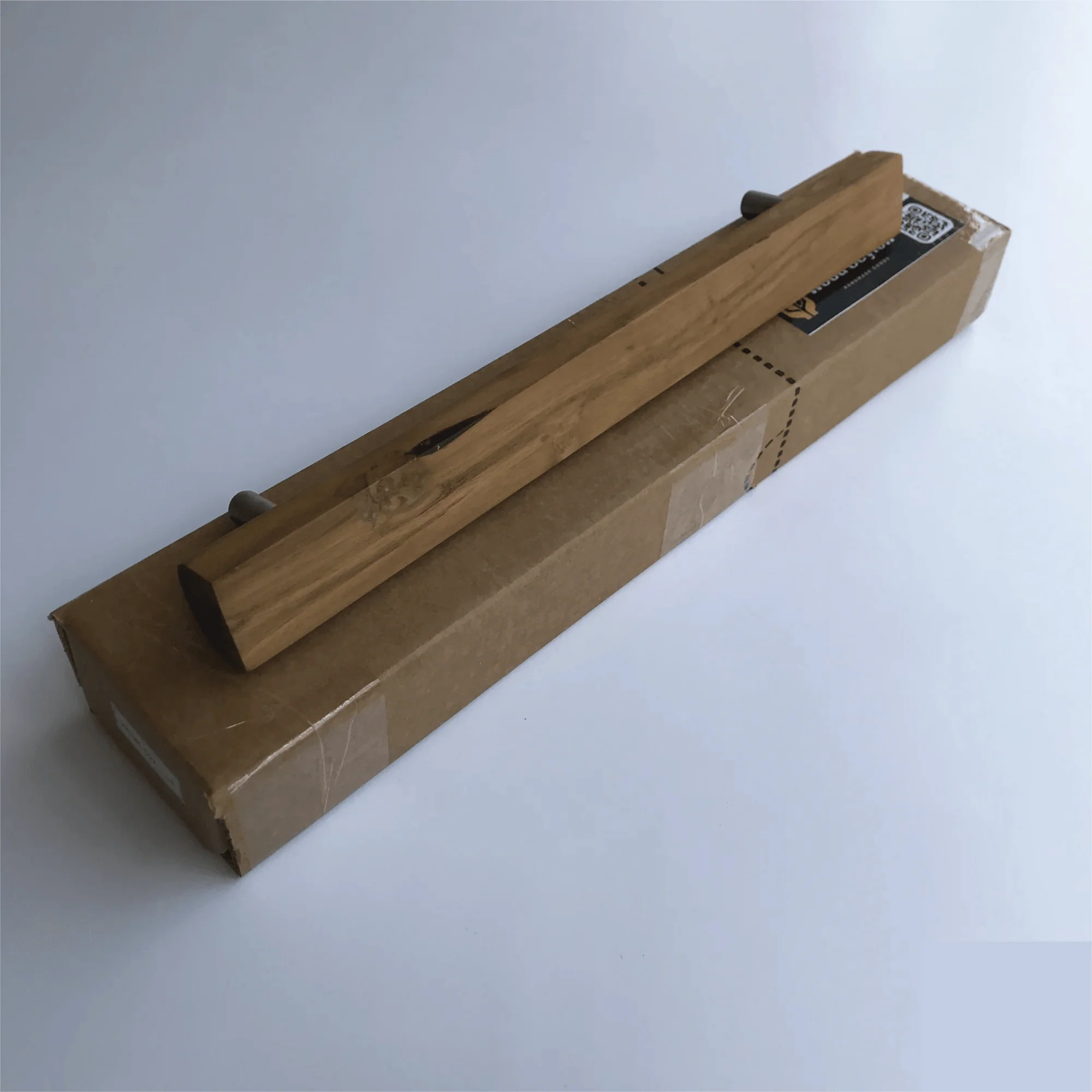 Teak barn door handles by Wood Ceylon featuring a sleek design and natural finish