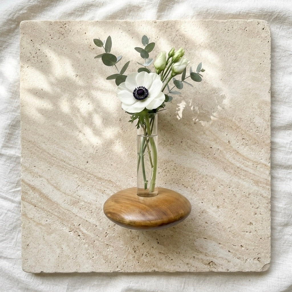 Teak Pebble Vase with clear glass tube and fresh flowers