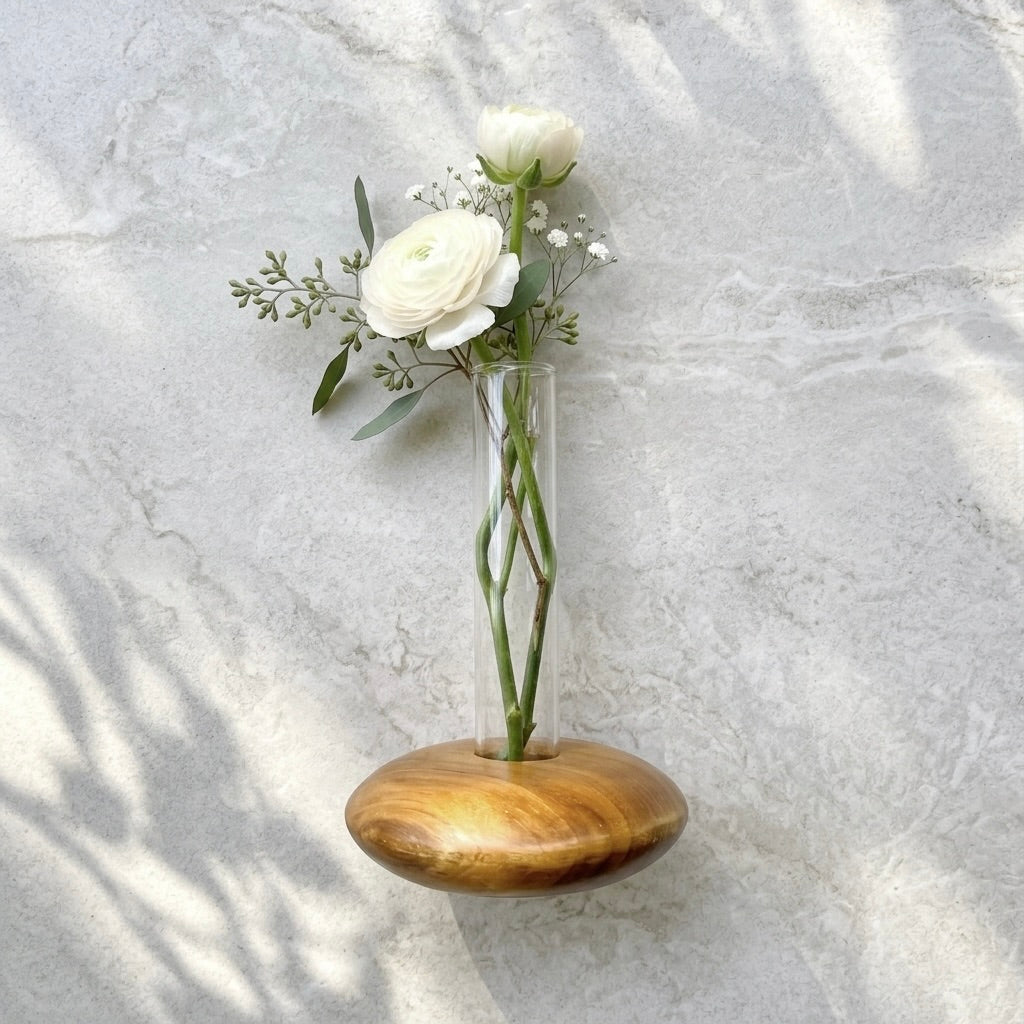 Teak Pebble Vase with clear glass tube for floral displays