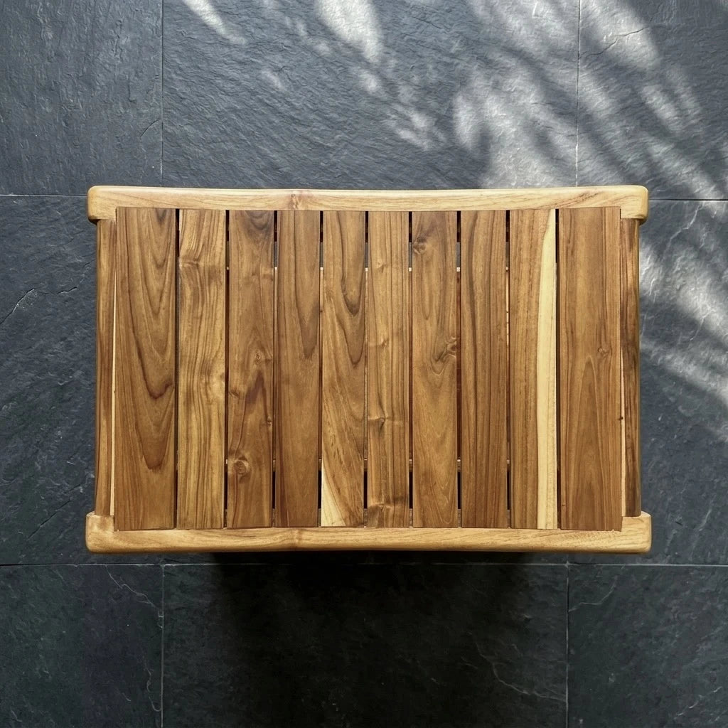 Top view of a teak shower bench with natural wood finish