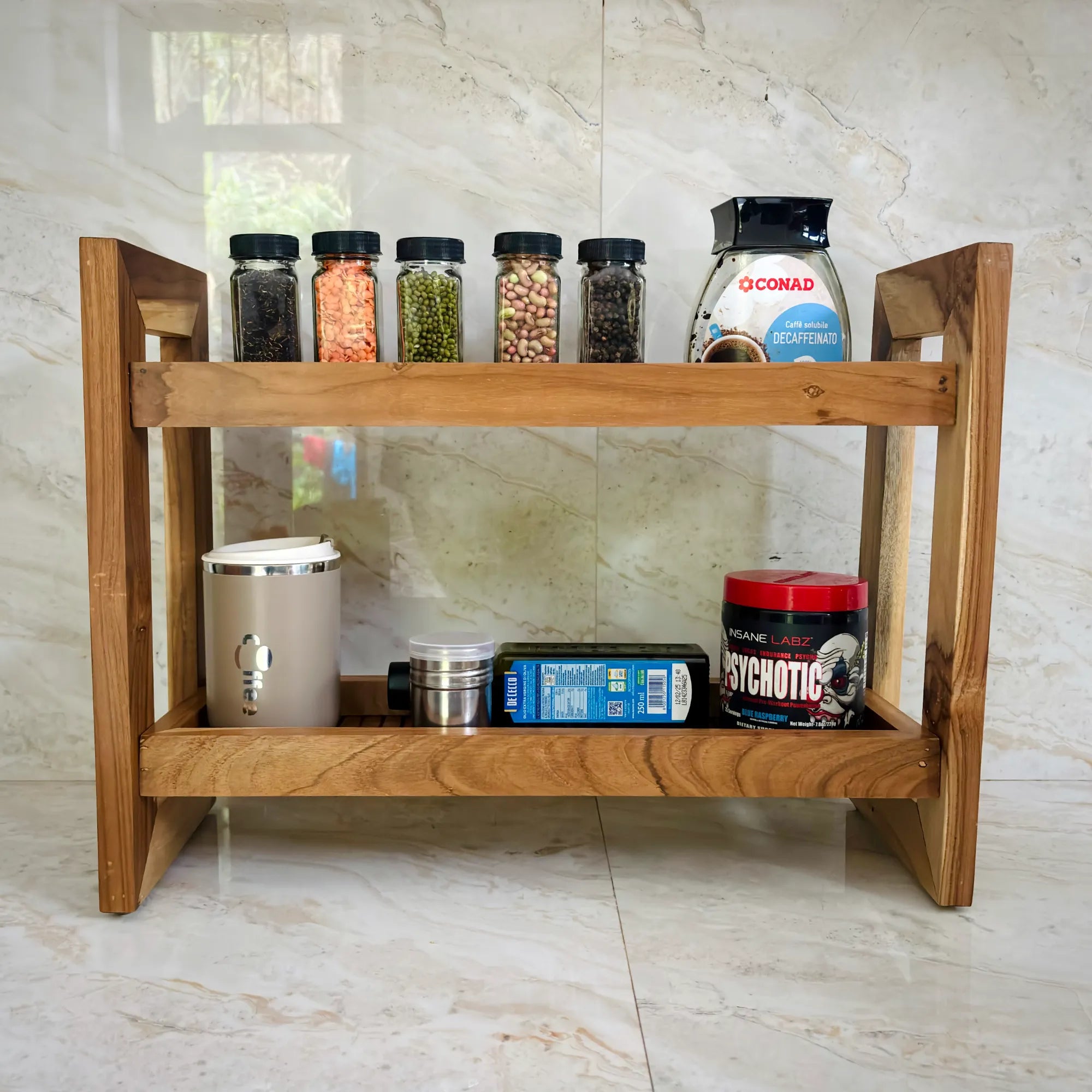 Teak wood countertop spice rack featuring two shelves with various spice jars and containers