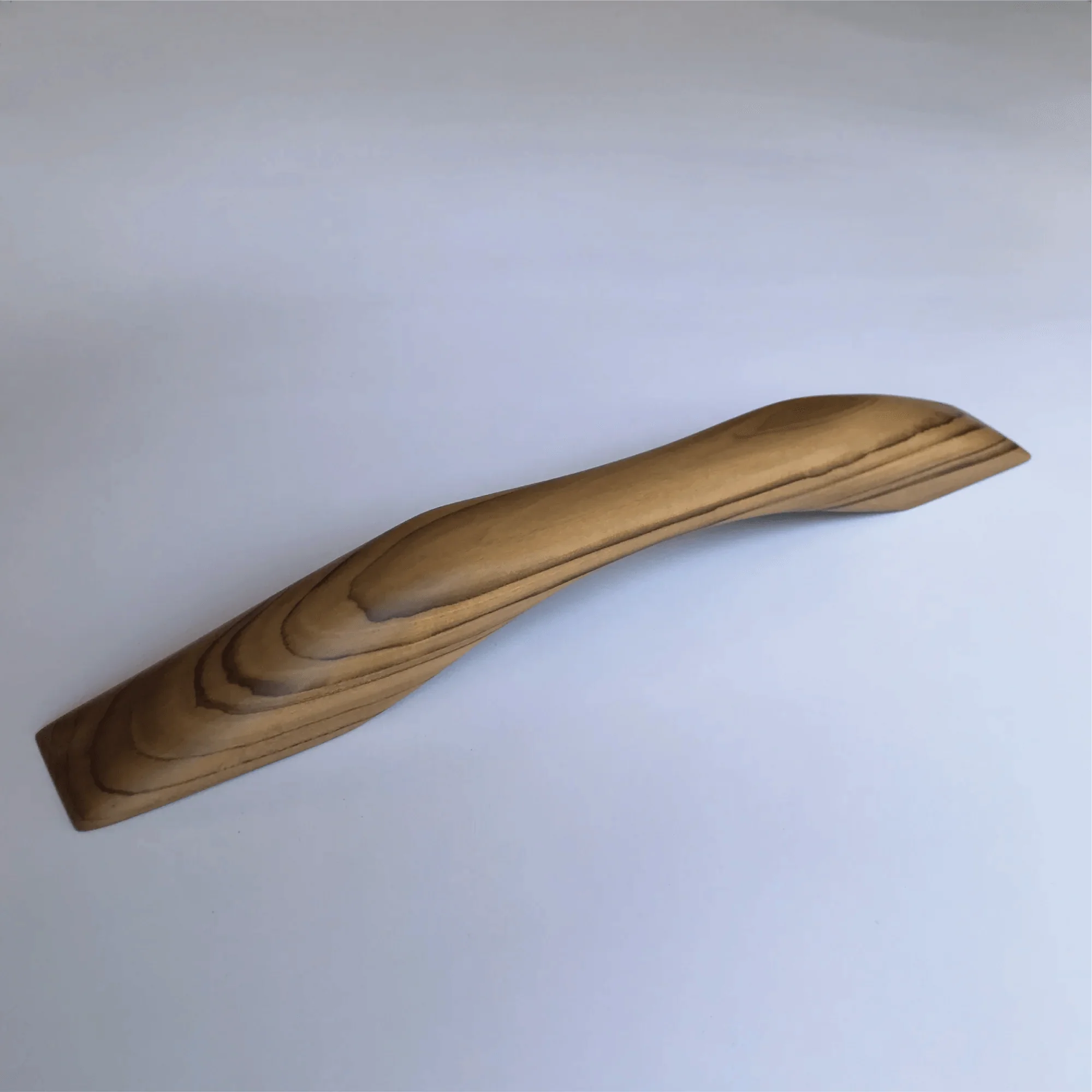 Elegant teak wooden door handle with a smooth curved design for modern interiors