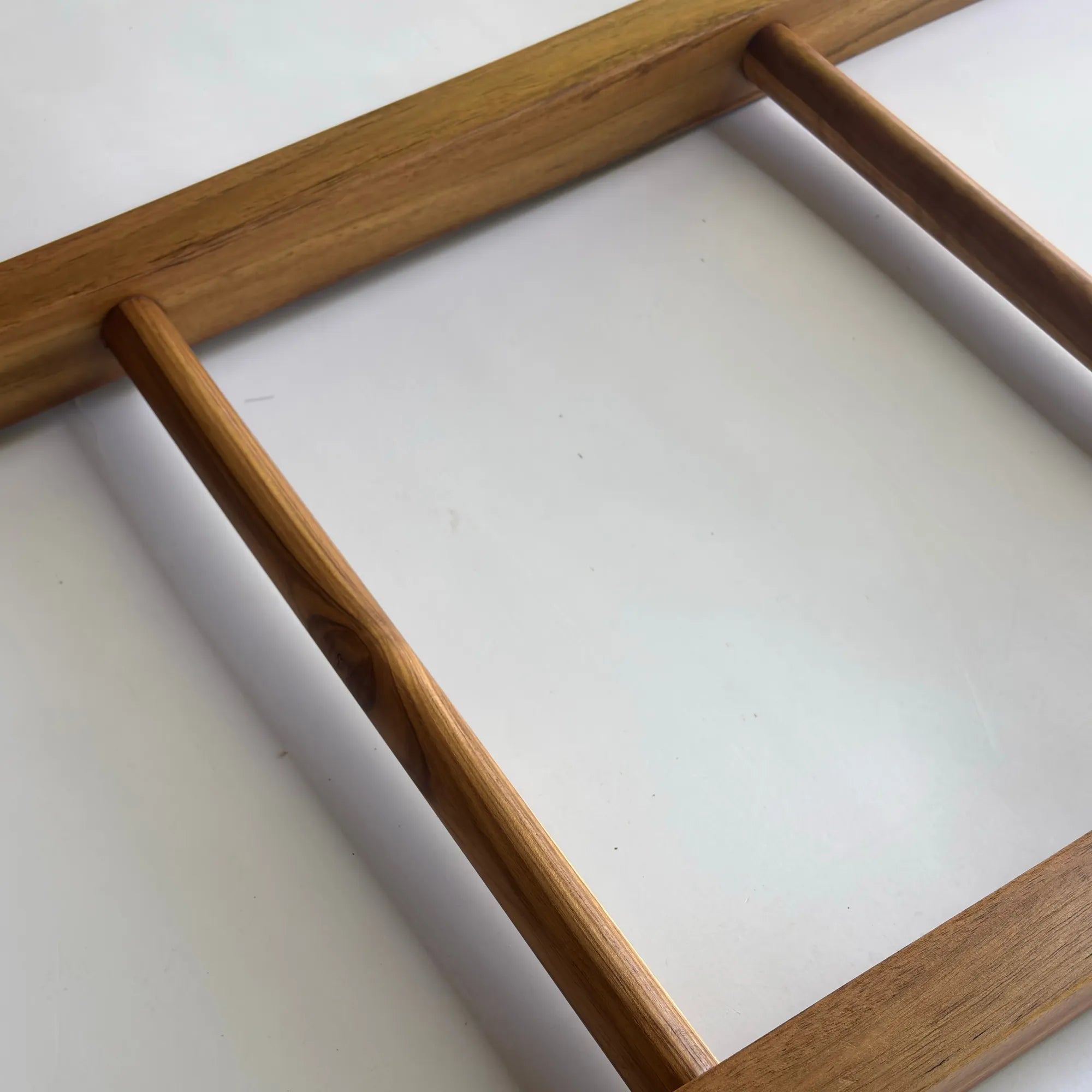 Teak towel ladder rack in natural wood finish for bathroom organization