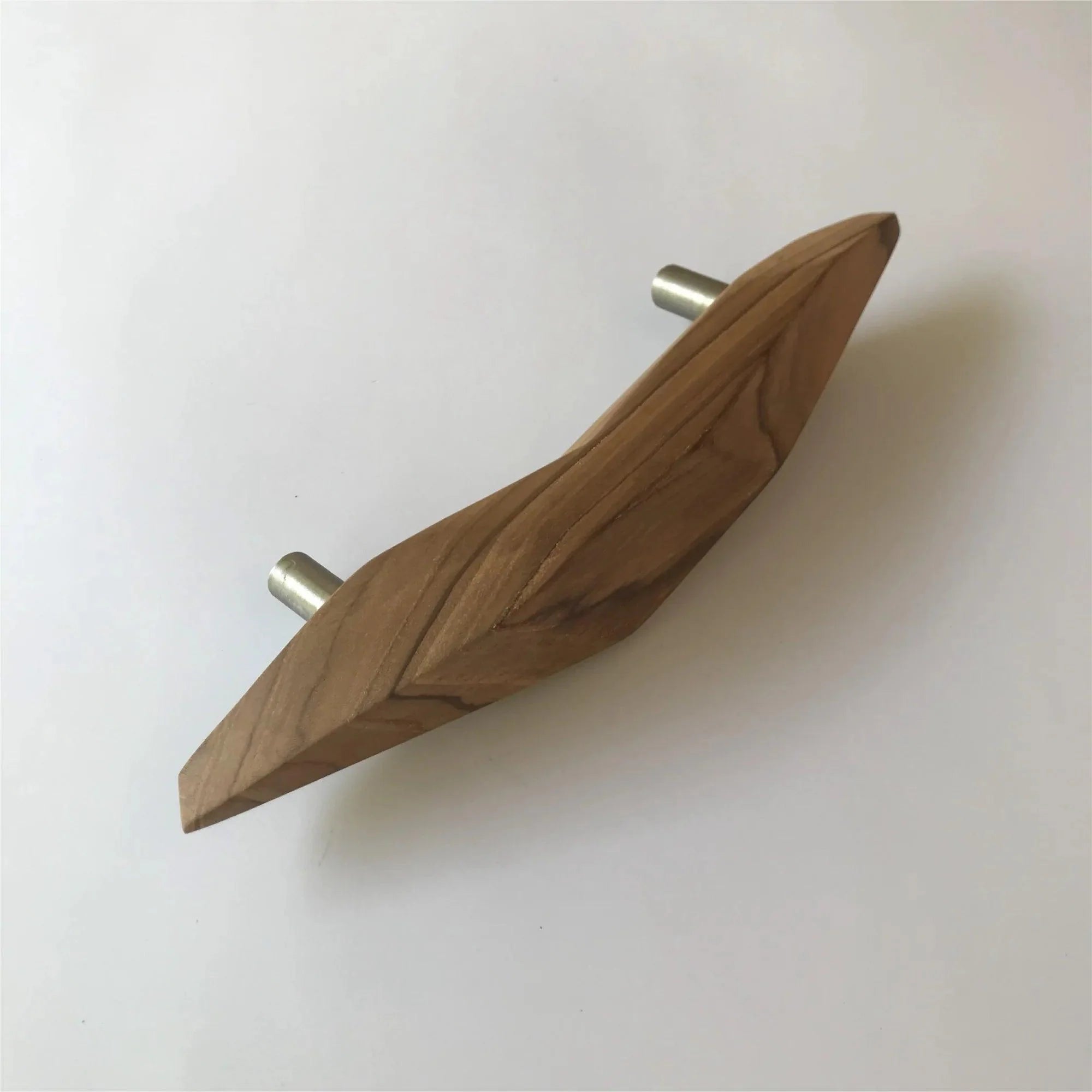 Crafted unique teak door handle featuring a sleek design and metal accents for modern interiors