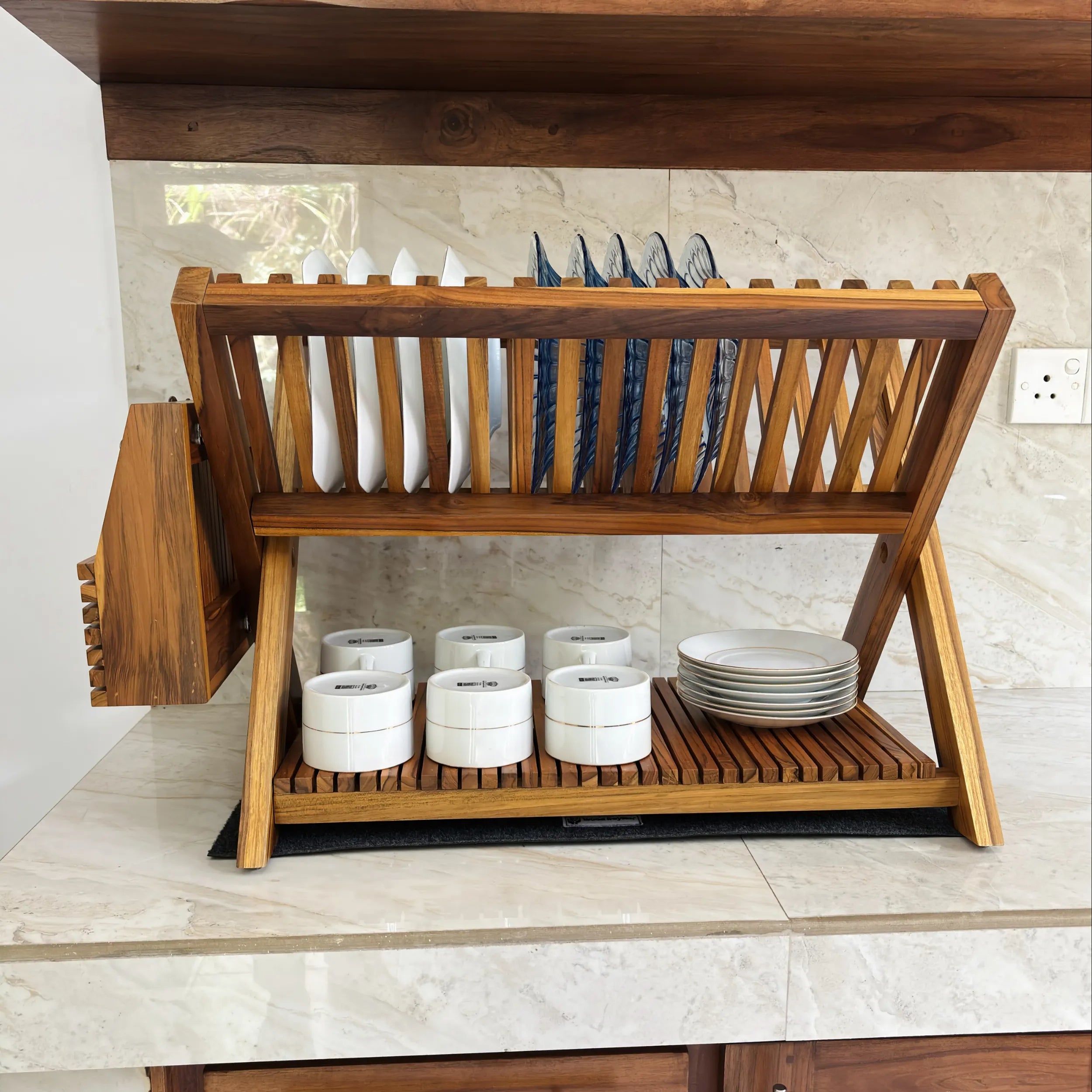 Wood Ceylon wooden dish drying rack with slots for plates and cups on kitchen countertop