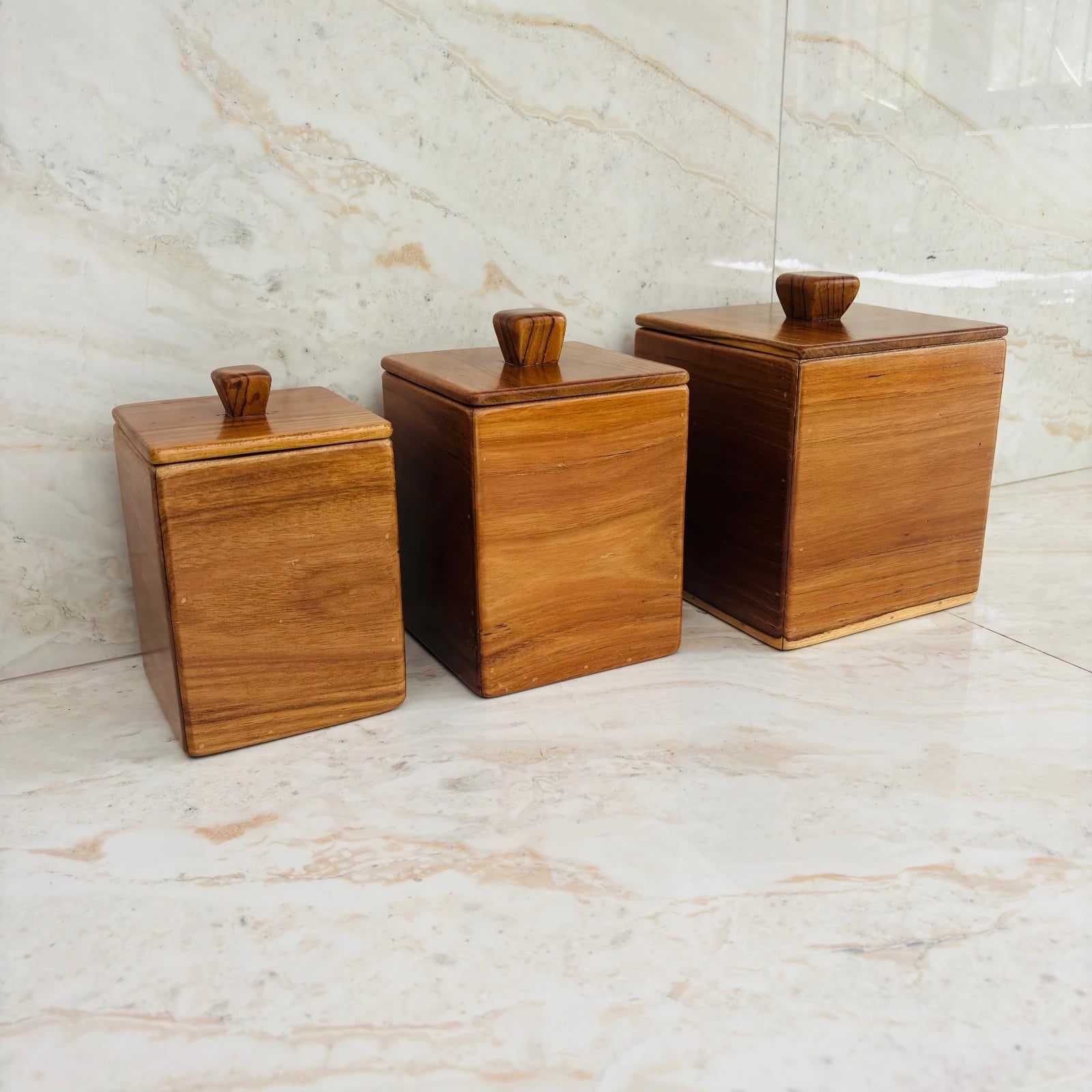 Wood Ceylon wooden kitchen canister set of 3 with square shape and lids on marble countertop