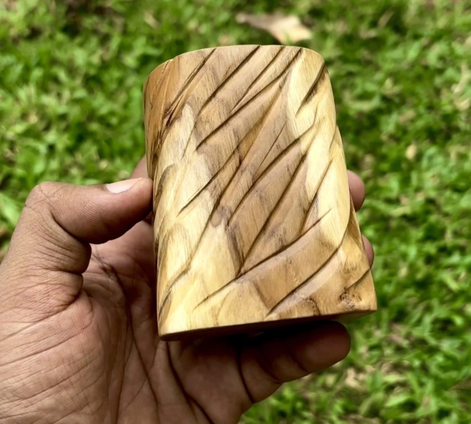 Handcrafted wooden plant pot for succulents with a unique textured design and natural finish