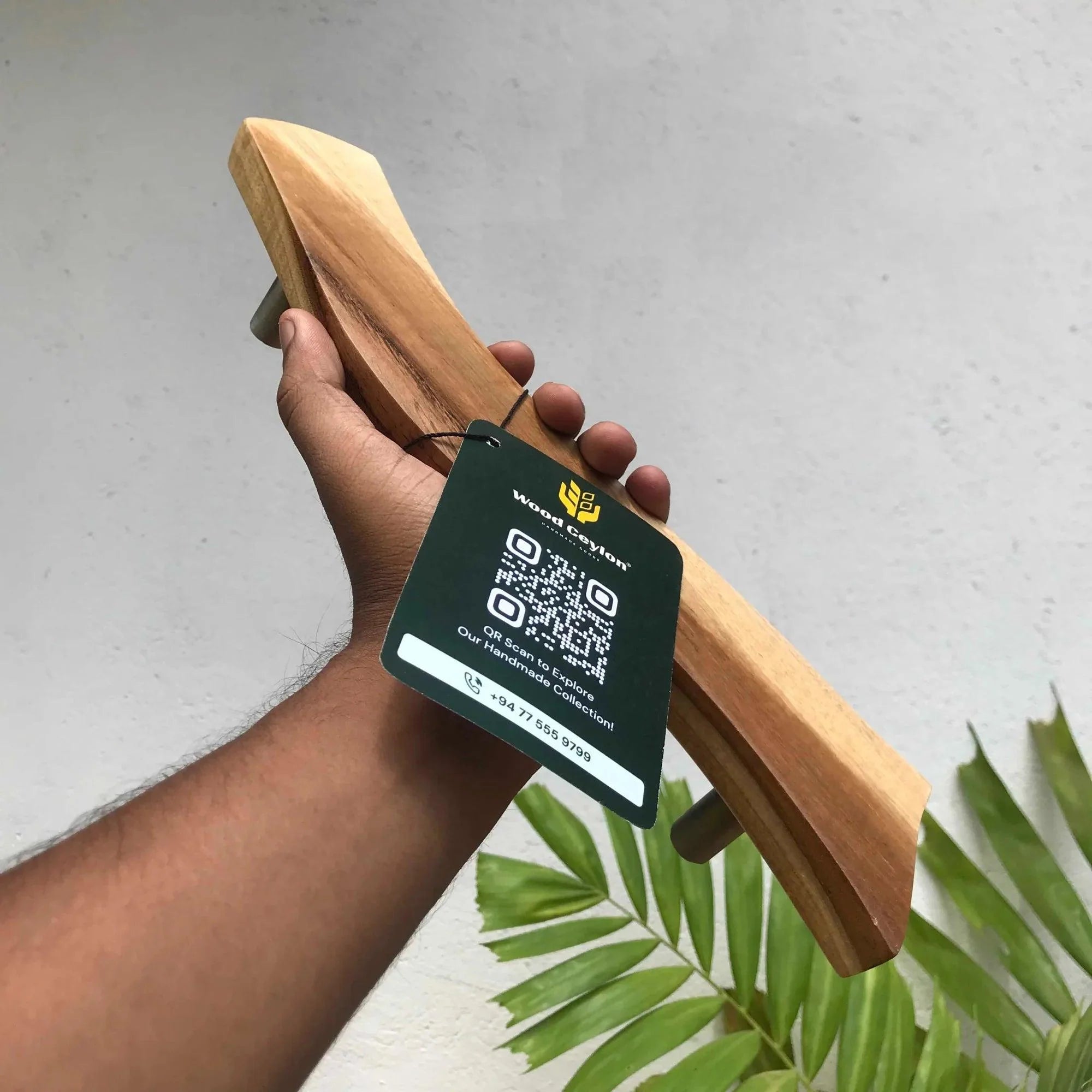 Wood Ceylon wooden Screen Door Handle held in hand showcasing smooth natural finish and ergonomic design