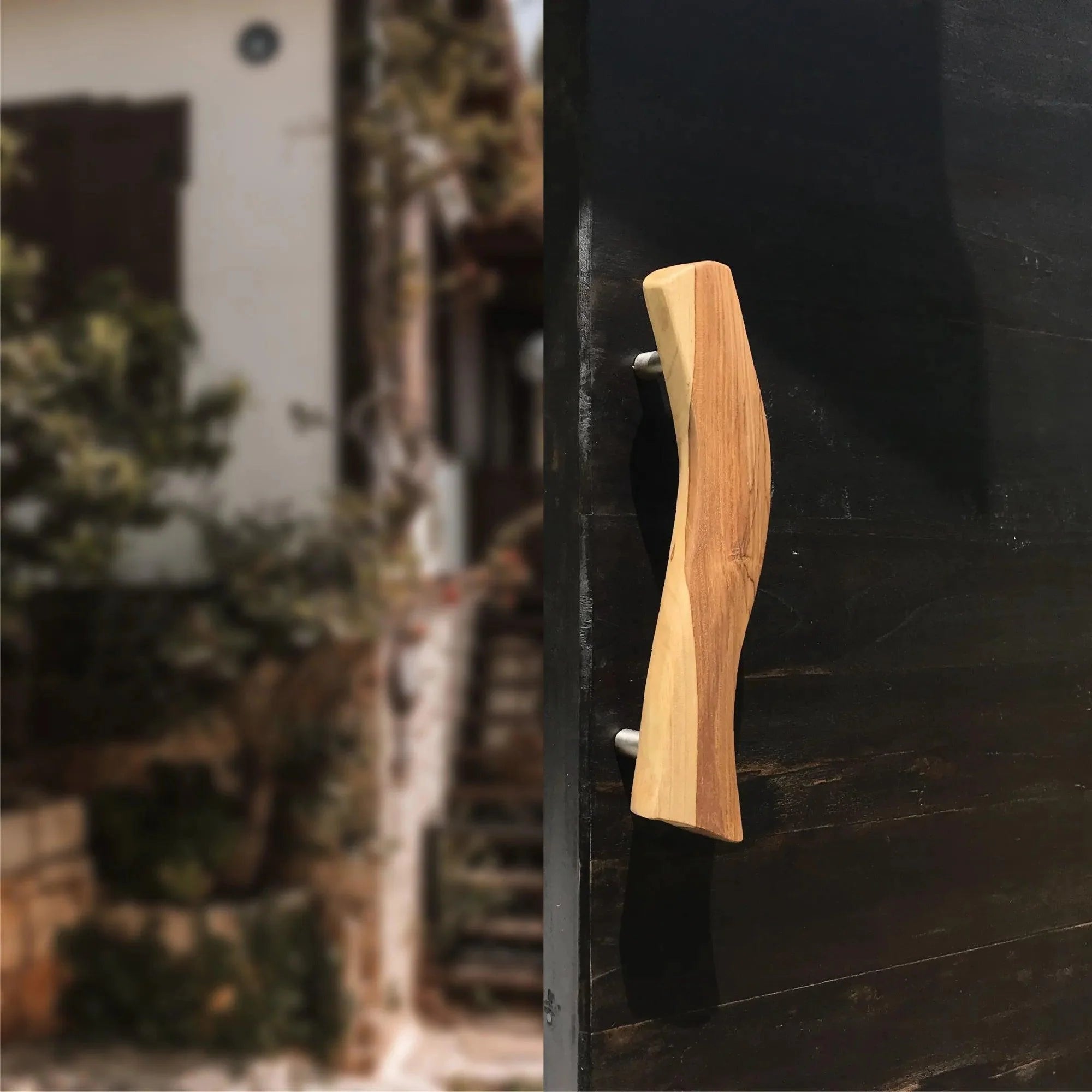 Wood Ceylon wooden Screen Door Handle with natural finish mounted on a black door